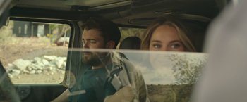 Movie still from “Robots” (2023), directed by Casper Christensen – A man and a woman in the back seat of a car; Close Up shot, Over the shoulder angle
