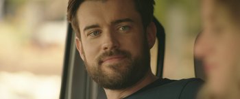 Movie still from “Robots” (2023), directed by Casper Christensen – A person with a beard; Close Up shot, Over the shoulder angle