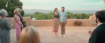 Movie still from “Robots” (2023), directed by Casper Christensen – A man and a woman standing next to each other; Wide shot, Over the shoulder angle