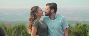 Movie still from “Robots” (2023), directed by Casper Christensen – A man and a woman standing next to each other; Close Up shot, Over the shoulder angle