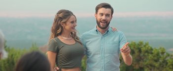 Movie still from “Robots” (2023), directed by Casper Christensen – A man and a woman standing next to each other; Medium shot, Over the shoulder angle