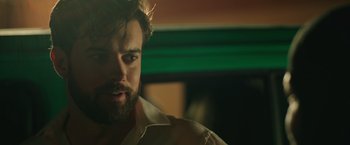 Movie still from “Robots” (2023), directed by Casper Christensen – A person with a beard; Close Up shot, Over the shoulder angle