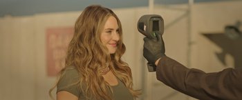 Movie still from “Robots” (2023), directed by Casper Christensen – A woman getting her hair done by a man; Close Up shot, Over the shoulder angle