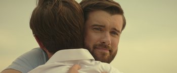 Movie still from “Robots” (2023), directed by Casper Christensen – A person hugging another person; Close Up shot, Over the shoulder angle