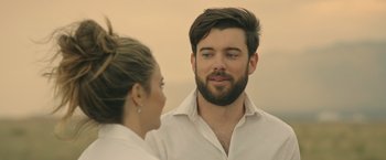 Movie still from “Robots” (2023), directed by Casper Christensen – A man and a woman are talking to each other; Close Up shot, Over the shoulder angle