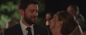 Movie still from “Robots” (2023), directed by Casper Christensen – A man and a woman are smiling at each other; Close Up shot, Over the shoulder angle