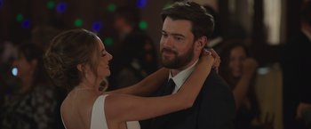 Movie still from “Robots” (2023), directed by Casper Christensen – A man and a woman are dancing at a party; Close Up shot, Over the shoulder angle