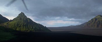 Movie still from “Rogue One: A Star Wars Story” (2016), directed by Gareth Edwards – A view of a mountain range with a cloudy sky in the background; Extreme Wide shot, Low angle