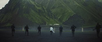 Movie still from “Rogue One: A Star Wars Story” (2016), directed by Gareth Edwards – A group of people standing on top of a mountain; Extreme Wide shot, Low angle