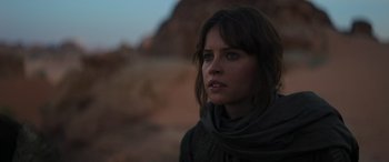 Movie still from “Rogue One: A Star Wars Story” (2016), directed by Gareth Edwards – A person wearing a scarf; Close Up shot, Low angle