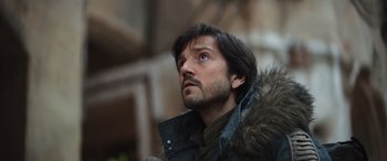 Movie still from “Rogue One: A Star Wars Story” (2016), directed by Gareth Edwards – A person wearing a jacket; Close Up shot, Low angle