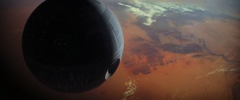 Movie still from “Rogue One: A Star Wars Story” (2016), directed by Gareth Edwards – A view of the earth from a space station; Extreme Wide shot, Overhead angle