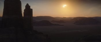 Movie still from “Rogue One: A Star Wars Story” (2016), directed by Gareth Edwards – The sun is setting in the middle of the desert; Extreme Wide shot, Low angle