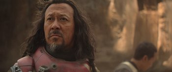 Movie still from “Rogue One: A Star Wars Story” (2016), directed by Gareth Edwards – A person with long black hair; Close Up shot, Over the shoulder angle