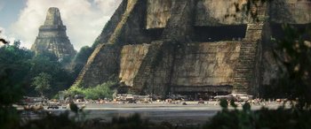 Movie still from “Rogue One: A Star Wars Story” (2016), directed by Gareth Edwards – An image of a large rock formation in the middle of a field; Extreme Wide shot, High angle