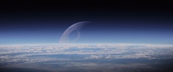 Movie still from “Rogue One: A Star Wars Story” (2016), directed by Gareth Edwards – An image of an image of the moon in the night sky; Extreme Wide shot, Overhead angle