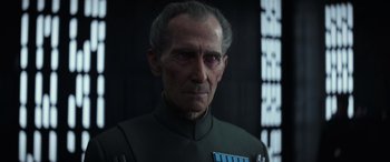 Movie still from “Rogue One: A Star Wars Story” (2016), directed by Gareth Edwards – An old man in a star wars costume; Close Up shot, Over the shoulder angle