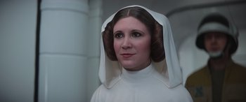 Movie still from “Rogue One: A Star Wars Story” (2016), directed by Gareth Edwards – A person wearing a star wars costume; Close Up shot, Low angle