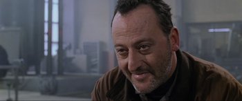 Movie still from “Ronin” (1998), directed by John Frankenheimer – A person with a beard; Close Up shot, Over the shoulder angle