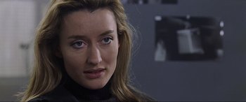 Movie still from “Ronin” (1998), directed by John Frankenheimer – A person with long hair; Close Up shot, Over the shoulder angle