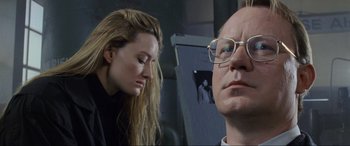 Movie still from “Ronin” (1998), directed by John Frankenheimer – A man and a woman looking at each other; Close Up shot, Over the shoulder angle