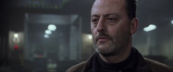 Movie still from “Ronin” (1998), directed by John Frankenheimer – A person with a beard; Close Up shot, Low angle