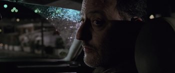Movie still from “Ronin” (1998), directed by John Frankenheimer – A person in a car looking out of the window; Close Up shot, Low angle