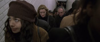 Movie still from “Ronin” (1998), directed by John Frankenheimer – A group of people that are standing in a room; Medium shot, High angle