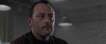 Movie still from “Ronin” (1998), directed by John Frankenheimer – A person wearing a jacket; Close Up shot, Low angle