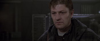 Movie still from “Ronin” (1998), directed by John Frankenheimer – A person wearing a jacket; Close Up shot, Low angle