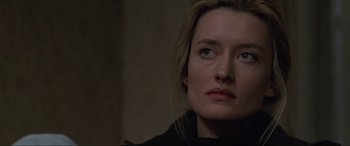 Movie still from “Ronin” (1998), directed by John Frankenheimer – A person with long blonde hair; Close Up shot, Low angle