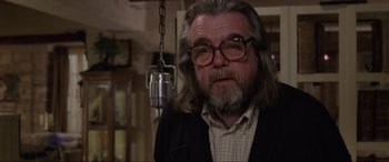 Movie still from “Ronin” (1998), directed by John Frankenheimer – An older man with long hair and a beard; Close Up shot, Low angle