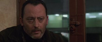 Movie still from “Ronin” (1998), directed by John Frankenheimer – A person wearing a jacket; Close Up shot, Low angle