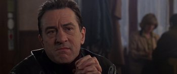 Movie still from “Ronin” (1998), directed by John Frankenheimer – A person wearing a leather jacket; Close Up shot, Low angle