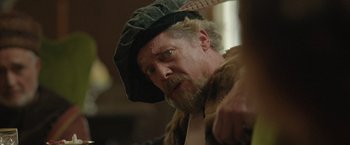 Movie still from “Rosaline” (2022), directed by Karen Maine – A person wearing a hat; Close Up shot, Over the shoulder angle