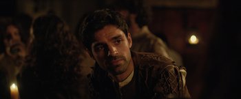 Movie still from “Rosaline” (2022), directed by Karen Maine – A person wearing a jacket; Close Up shot, Over the shoulder angle