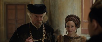 Movie still from “Rosaline” (2022), directed by Karen Maine – A man and a woman dressed in medieval clothing; Medium shot, Over the shoulder angle