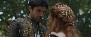 Movie still from “Rosaline” (2022), directed by Karen Maine – A person wearing a costume; Close Up shot, Over the shoulder angle