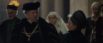 Movie still from “Rosaline” (2022), directed by Karen Maine – A man and a woman in medieval garb talking to each other; Medium shot, Over the shoulder angle