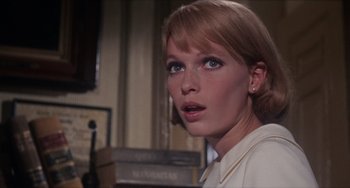 Movie still from “Rosemary's Baby” (1968), directed by Roman Polanski – A person wearing a white shirt; Close Up shot, Low angle