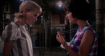 Movie still from “Rosemary's Baby” (1968), directed by Roman Polanski – Two women talking to each other in an industrial setting; Close Up shot, Over the shoulder angle