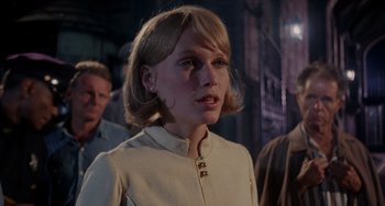 Movie still from “Rosemary's Baby” (1968), directed by Roman Polanski – A young woman with blonde hair wearing a white dress; Close Up shot, Low angle