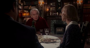 Movie still from “Rosemary's Baby” (1968), directed by Roman Polanski – A man and a woman sitting at a dinner table; Medium shot, Over the shoulder angle