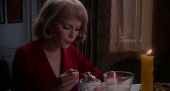 Movie still from “Rosemary's Baby” (1968), directed by Roman Polanski – A woman sitting at a table with a bowl of ice cream; Close Up shot, High angle