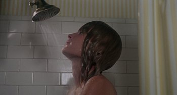 Movie still from “Rosemary's Baby” (1968), directed by Roman Polanski – A woman is taking a shower in the bathroom; Close Up shot, Low angle
