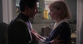 Movie still from “Rosemary's Baby” (1968), directed by Roman Polanski – A man and a woman standing next to each other; Close Up shot, Over the shoulder angle