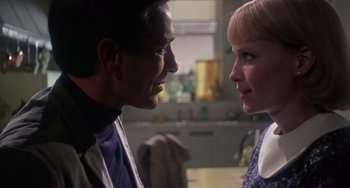Movie still from “Rosemary's Baby” (1968), directed by Roman Polanski – A man and a woman face to face in a kitchen; Close Up shot, Over the shoulder angle