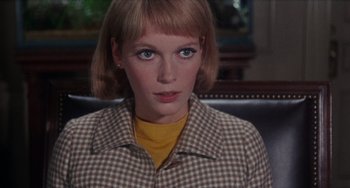 Movie still from “Rosemary's Baby” (1968), directed by Roman Polanski – A person wearing a plaid shirt; Close Up shot, Low angle