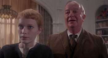 Movie still from “Rosemary's Baby” (1968), directed by Roman Polanski – A man and a woman standing next to each other in a room; Close Up shot, Low angle