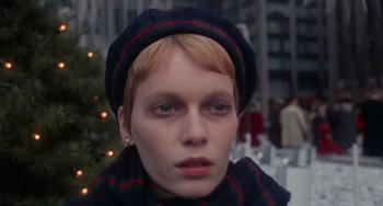Movie still from “Rosemary's Baby” (1968), directed by Roman Polanski – A person wearing a hat and a scarf; Close Up shot, High angle